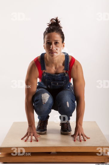 Kneeling pose blue jeans red singlet of Rebecca