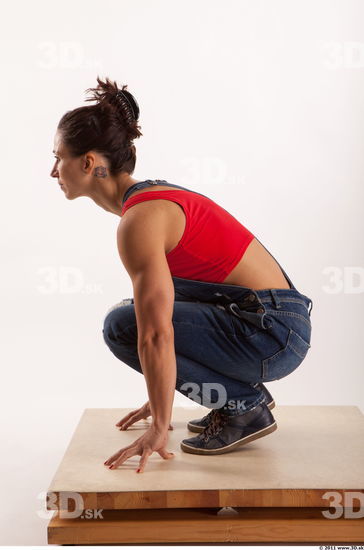 Kneeling pose blue jeans red singlet of Rebecca