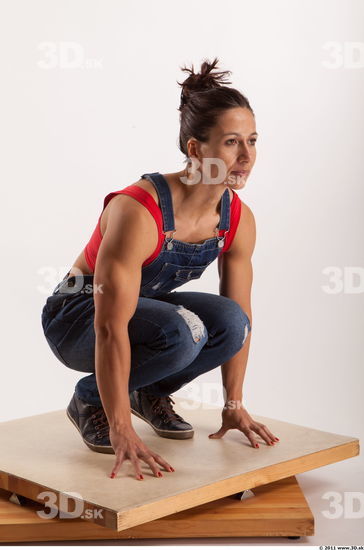 Kneeling pose blue jeans red singlet of Rebecca