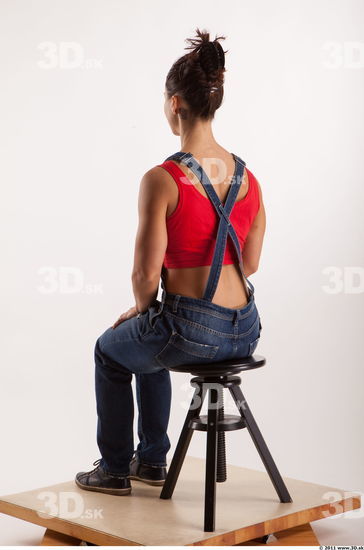 Sitting pose blue jeans red singlet of Rebecca