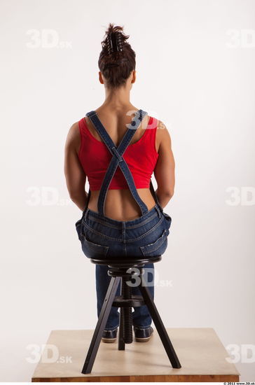 Sitting pose blue jeans red singlet of Rebecca