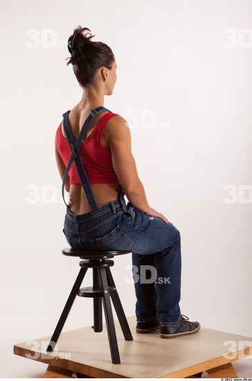 Sitting pose blue jeans red singlet of Rebecca