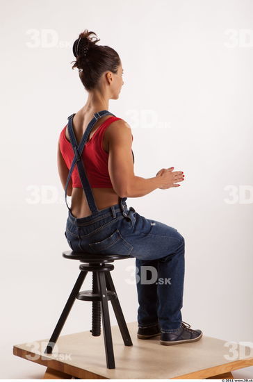 Sitting pose blue jeans red singlet of Rebecca