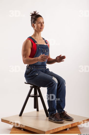 Sitting pose blue jeans red singlet of Rebecca