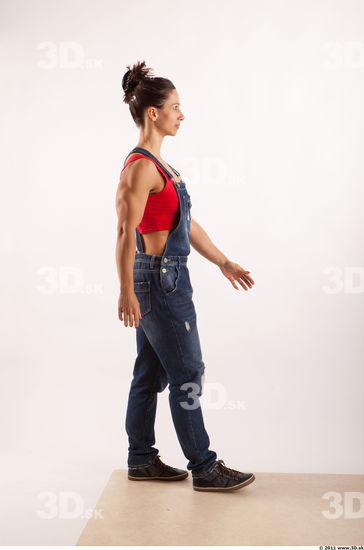 Walking pose blue jeans red singlet of Rebecca