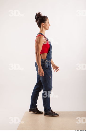 Walking pose blue jeans red singlet of Rebecca