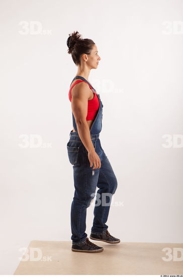 Walking pose blue jeans red singlet of Rebecca