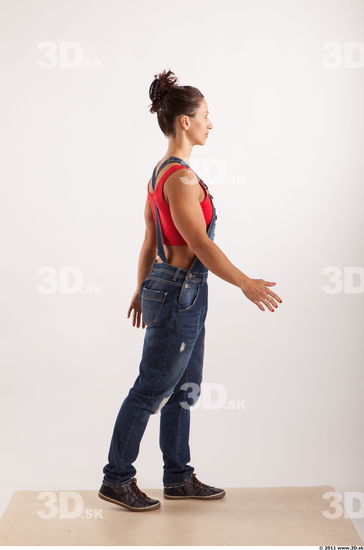 Walking pose blue jeans red singlet of Rebecca