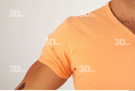 Upper body orange tshirt of Harold