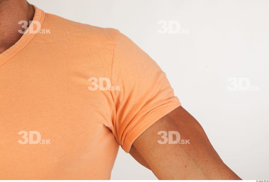 Upper body orange tshirt of Harold