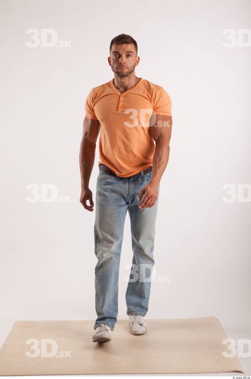 Walking pose orange thsirt light blue jeans of bodybuilder Harold