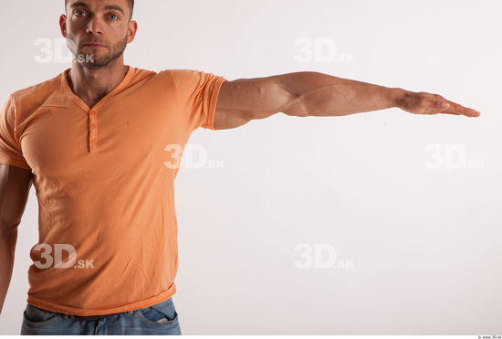 Arm moving pose orange thsirt of bodybuilder Harold