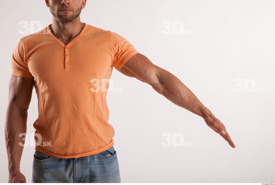 Arm moving pose orange thsirt of bodybuilder Harold