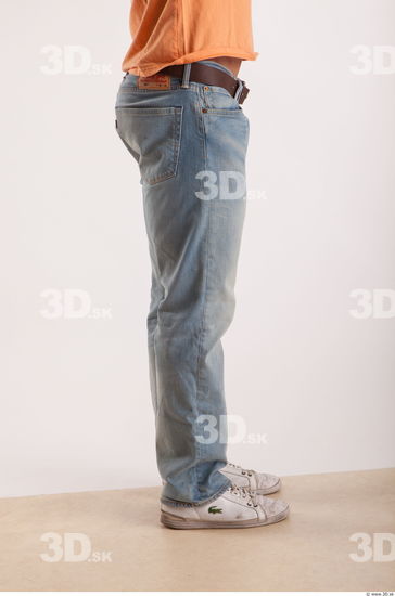 Leg moving pose light blue jeans of bodybuilder Harold