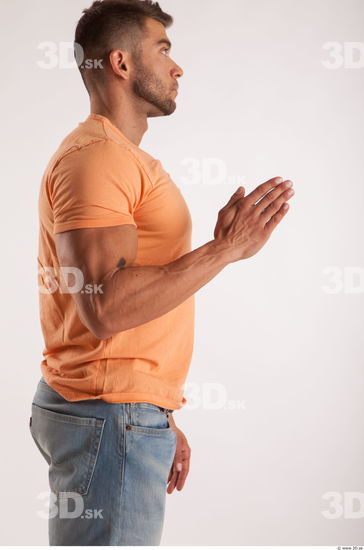 Arm moving pose orange thsirt of bodybuilder Harold