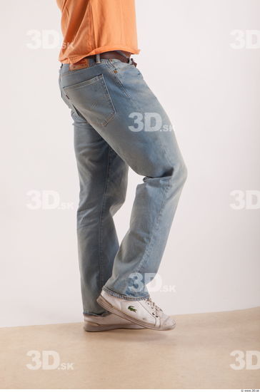 Leg moving pose light blue jeans of bodybuilder Harold