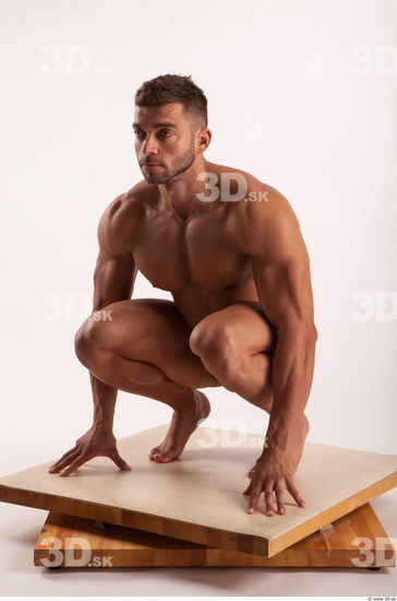 Kneeling pose light of bodybuilder Harold