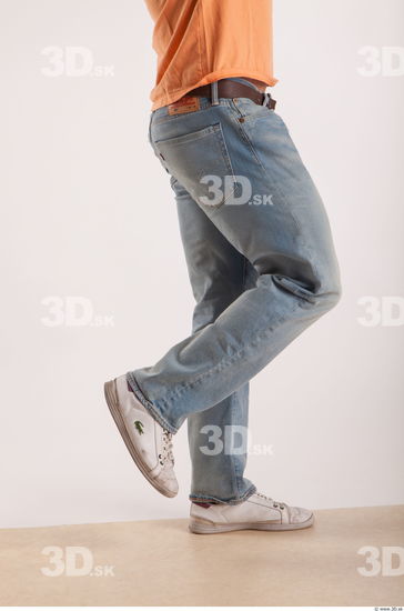 Leg moving pose light blue jeans of bodybuilder Harold