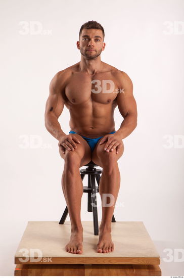 Sitting pose light of bodybuilder Harold