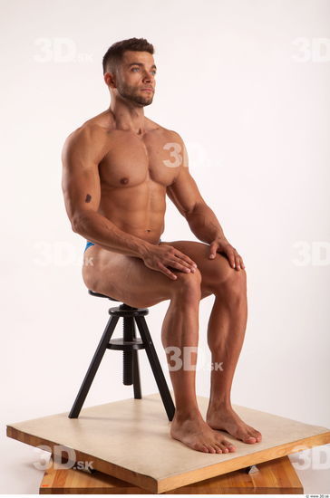 Sitting pose light of bodybuilder Harold