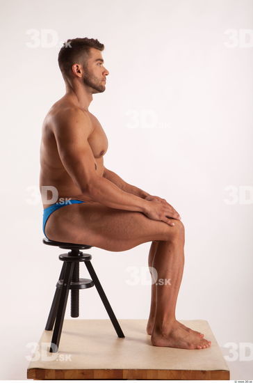 Sitting pose light of bodybuilder Harold