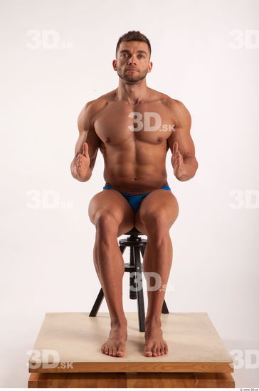 Sitting pose light of bodybuilder Harold