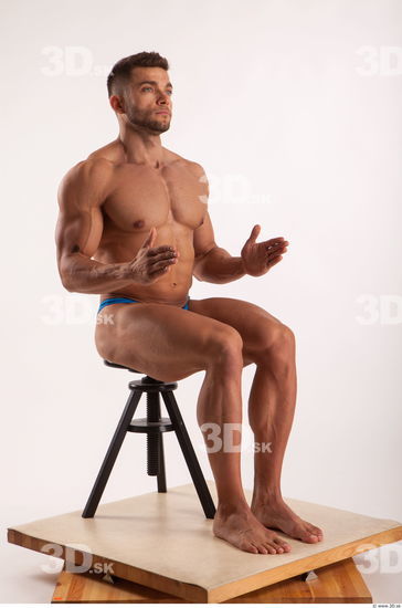 Sitting pose light of bodybuilder Harold