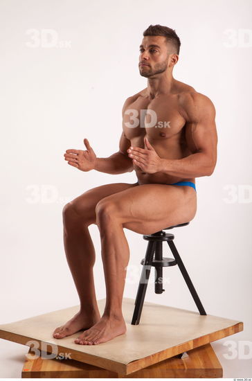 Sitting pose light of bodybuilder Harold