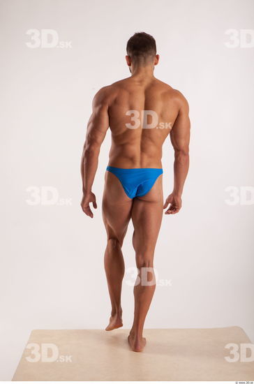 Walking pose light of bodybuilder Harold