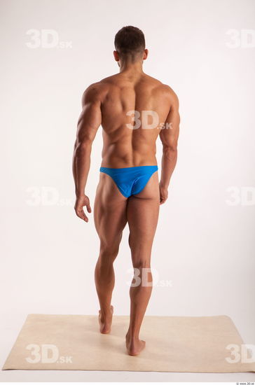 Walking pose light of bodybuilder Harold