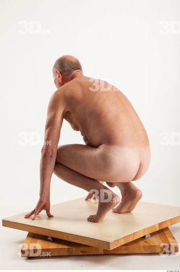 Kneeling pose of nude Ed