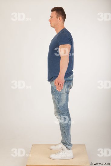 Whole body blue tshirt light blue jeans modeling a pose of Andrew