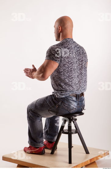 Sitting reference jeans tshirt of Sebastian