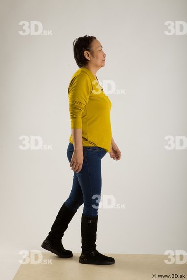 Walking reference of yellow sweater blue jeans Gwendolyn