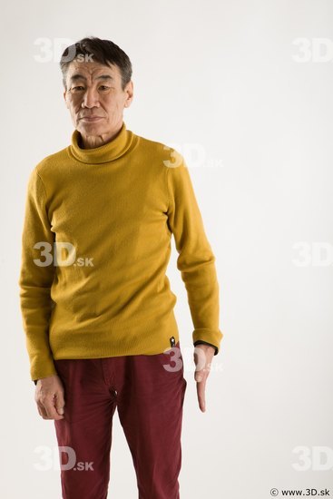Arm flexing reference of yellow sweater red trousers Sidney