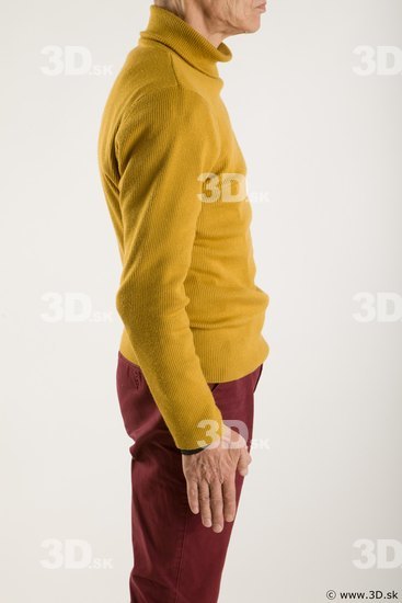 Arm flexing reference of yellow sweater red trousers Sidney
