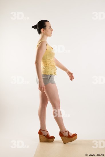 Walking reference of nude whole body yellow t shirt gray shorts red shoes