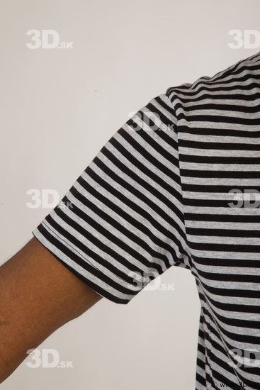 Upper black white striped shirt brown jeans of Arturo