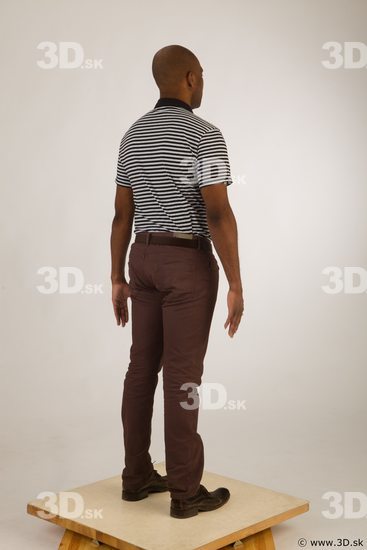 Whole body black white striped shirt brown jeans brown shoes of Arturo