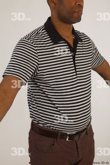 Upper black white striped shirt brown jeans of Arturo