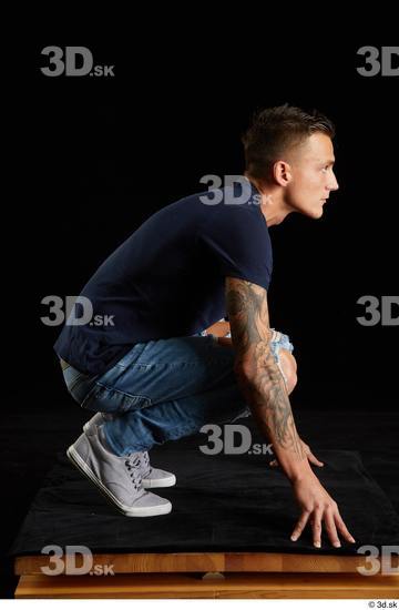 Whole Body Man White Shirt Jeans Athletic Kneeling Studio photo references