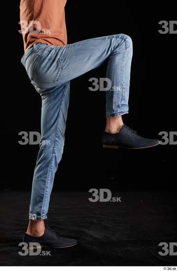 Alessandro Katz  black shoes blue jeans casual flexing leg side view  jpg