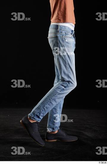 Alessandro Katz  black shoes blue jeans casual flexing leg side view  jpg