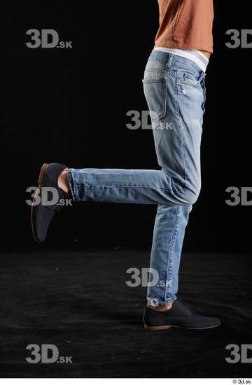 Alessandro Katz  black shoes blue jeans casual flexing leg side view  jpg