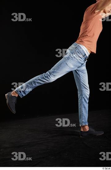 Alessandro Katz  black shoes blue jeans casual flexing leg side view  jpg