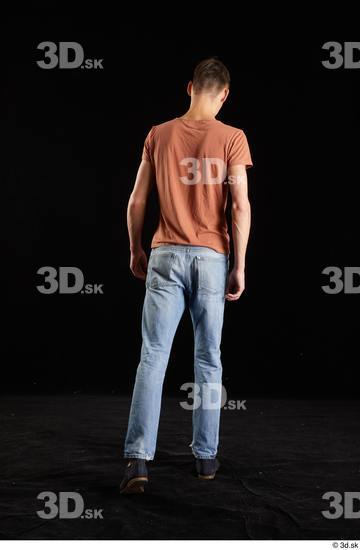 Alessandro Katz  back view black shoes blue jeans brown t shirt casual dressed walking whole body  jpg