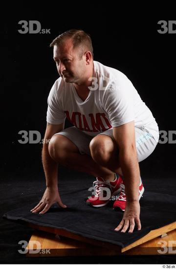 Whole Body Man White Sports Shirt Shorts Chubby Kneeling Studio photo references