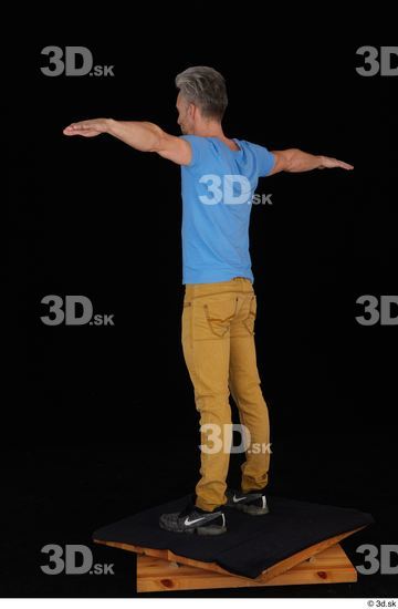 Lutro black sneakers blue t shirt casual dressed standing t poses whole body yellow jeans  jpg