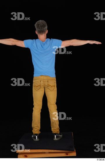 Lutro black sneakers blue t shirt casual dressed standing t poses whole body yellow jeans  jpg