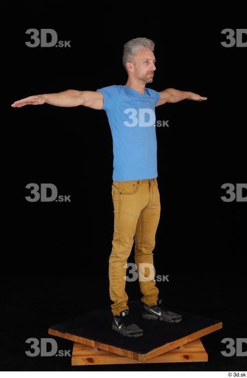 Lutro black sneakers blue t shirt casual dressed standing t poses whole body yellow jeans  jpg